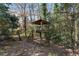 Custom-built two-story treehouse nestled amongst lush trees, perfect for to explore at 790 Denards Se Ml, Marietta, GA 30067