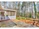 Charming screened-in porch and wooden deck overlooking the lush, verdant backyard at 8698 Twin Oaks Dr, Jonesboro, GA 30236