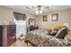 Cozy bedroom featuring decorative accents, comfortable furnishings, and a ceiling fan for added comfort at 8698 Twin Oaks Dr, Jonesboro, GA 30236