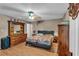 Comfortable bedroom featuring laminate flooring, a ceiling fan, and classic furnishings throughout at 8698 Twin Oaks Dr, Jonesboro, GA 30236