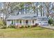 Charming single-story home with a well-manicured lawn and attached two car garage at 8698 Twin Oaks Dr, Jonesboro, GA 30236