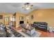Living room with hardwood flooring, a ceiling fan and a comfortable seating area at 8698 Twin Oaks Dr, Jonesboro, GA 30236