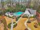 A scenic aerial view of the community pool and clubhouse with landscaped walkways at 1198 Olmsted Park Rd, Decatur, GA 30033