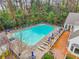 An aerial view of a community pool with lounge chairs, landscaping and a community building at 1198 Olmsted Park Rd, Decatur, GA 30033