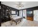 Stylish bedroom with a modern ceiling fan, geometric wallpaper, and a neutral color palette at 1198 Olmsted Park Rd, Decatur, GA 30033