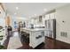 Bright, open kitchen features a large island with seating and stainless steel appliances at 1198 Olmsted Park Rd, Decatur, GA 30033