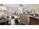 Bright and airy living room featuring hardwood floors and a comfortable seating arrangement at 1198 Olmsted Park Rd, Decatur, GA 30033