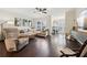 Spacious living room with hardwood floors, large windows, and comfortable seating at 1198 Olmsted Park Rd, Decatur, GA 30033