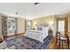 Bright bedroom featuring hardwood floors, a patterned rug and matching curtains, plus two windows for natural light at 2820 Andrews Nw Dr, Atlanta, GA 30305