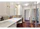 Dressing room area featuring a long counter, upper storage, vanity mirror and access to other rooms and ample closet space at 2820 Andrews Nw Dr, Atlanta, GA 30305