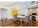 Dining room featuring terra cotta floors, a white table with patterned chairs, and a built-in workstation at 2820 Andrews Nw Dr, Atlanta, GA 30305