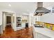 Bright kitchen featuring stainless steel appliances, white cabinetry, gas cooktop and terra cotta flooring at 2820 Andrews Nw Dr, Atlanta, GA 30305
