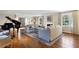 Living room with hardwood floors, neutral furniture, a fireplace and a grand piano at 2820 Andrews Nw Dr, Atlanta, GA 30305