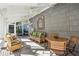 Covered porch with outdoor seating and ceiling fans, perfect for enjoying the outdoors in comfort and shade at 2820 Andrews Nw Dr, Atlanta, GA 30305