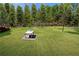 Expansive backyard with lush lawn and a gazebo, perfect for outdoor entertaining at 3076 Harris Mill Ct, Duluth, GA 30096