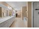 Expansive bathroom featuring a double sink vanity and separate tub and shower, offering a spa-like experience at 3076 Harris Mill Ct, Duluth, GA 30096