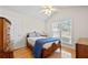 Bright bedroom with vaulted ceiling and wooden furnishings at 3076 Harris Mill Ct, Duluth, GA 30096