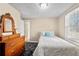 Comfortable bedroom with natural light and neutral tones creating a peaceful retreat at 3076 Harris Mill Ct, Duluth, GA 30096
