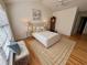 Cozy bedroom boasts a comfortable bed, ceiling fan, and hardwood floors at 3076 Harris Mill Ct, Duluth, GA 30096