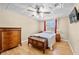 Cozy bedroom with warm wood accents and a serene atmosphere, ideal for relaxation at 3076 Harris Mill Ct, Duluth, GA 30096