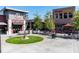 City street view with restaurants, outdoor seating, and a colorful modern sculpture at 3076 Harris Mill Ct, Duluth, GA 30096