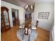 Dining room featuring glass table, seating for four, and hardwood floors at 3076 Harris Mill Ct, Duluth, GA 30096