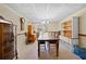 Inviting dining room perfect for gatherings, featuring a long table and natural light at 3076 Harris Mill Ct, Duluth, GA 30096