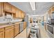 Spacious kitchen with stainless steel appliances and wood cabinets providing ample storage at 3076 Harris Mill Ct, Duluth, GA 30096