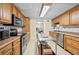 Well-equipped kitchen with stainless steel appliances and custom cabinetry for the cooking enthusiast at 3076 Harris Mill Ct, Duluth, GA 30096