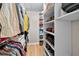 Organized walk-in closet with custom shelving providing ample storage for clothing and accessories at 3076 Harris Mill Ct, Duluth, GA 30096