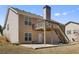 Exterior view of the backyard featuring a wooden deck and a patio area at 407 Black Fox Dr, Locust Grove, GA 30248