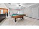 Spacious finished basement featuring a pool table and access to other rooms at 407 Black Fox Dr, Locust Grove, GA 30248