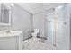Basement bathroom featuring a vanity with sink, toilet, and glass enclosed shower at 407 Black Fox Dr, Locust Grove, GA 30248