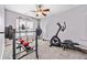 Well-lit exercise room featuring various fitness equipment and a ceiling fan at 407 Black Fox Dr, Locust Grove, GA 30248