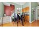 Eat-in kitchen features wooden cabinets, granite countertops, a breakfast bar, and hardwood floors at 407 Black Fox Dr, Locust Grove, GA 30248
