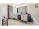 Bright primary bathroom features dual sinks, white cabinets, and a separate tub at 407 Black Fox Dr, Locust Grove, GA 30248