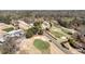 Scenic aerial shot featuring golf course views and the clubhouse with manicured grounds at 12600 Silver Fox Court, Roswell, GA 30075