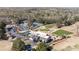 Stunning aerial view of the community clubhouse, golf course, tennis courts, and ample parking at 12600 Silver Fox Court, Roswell, GA 30075