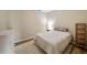 Neutral bedroom featuring a cozy bed, shag rug, and simple shelving unit at 12600 Silver Fox Court, Roswell, GA 30075