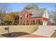 Charming two-story brick home with well-maintained landscaping and a curved driveway at 12600 Silver Fox Court, Roswell, GA 30075