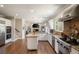 Spacious kitchen with an island, stainless steel appliances, and an open layout to the living room at 12600 Silver Fox Court, Roswell, GA 30075