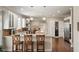 Beautiful kitchen with white cabinets, granite countertops, and stainless steel appliances at 12600 Silver Fox Court, Roswell, GA 30075