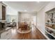 Modern kitchen with a breakfast nook and open access to the living room and dining area at 12600 Silver Fox Court, Roswell, GA 30075