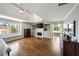 Spacious main bedroom with a fireplace, hardwood floors, and a decorative tray ceiling at 12600 Silver Fox Court, Roswell, GA 30075