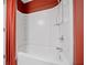 Clean and modern bathroom showcasing a well-maintained bathtub with a showerhead and crisp white tile surround at 215 Semel Nw Dr # 466, Atlanta, GA 30309