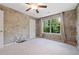 Bedroom featuring neutral colored walls and carpet with large window at 215 Semel Nw Dr # 466, Atlanta, GA 30309