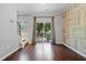Spacious living room with hardwood floors, a sliding glass door, and stylish wall accents at 215 Semel Nw Dr # 466, Atlanta, GA 30309