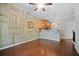 Open living room with hardwood floors, ceiling fan, and bar seating facing the kitchen at 215 Semel Nw Dr # 466, Atlanta, GA 30309
