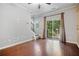 Elegant living area featuring hardwood floors, natural light, and staircase access at 215 Semel Nw Dr # 466, Atlanta, GA 30309
