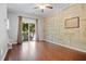 Bright living room featuring stylish decor, a ceiling fan, and access to an outdoor balcony at 215 Semel Nw Dr # 466, Atlanta, GA 30309
